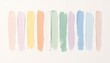 © somruthai - An array of pastel paint swatches meticulously arranged on a clean, bright surface creating a visually appealing texture and color palette