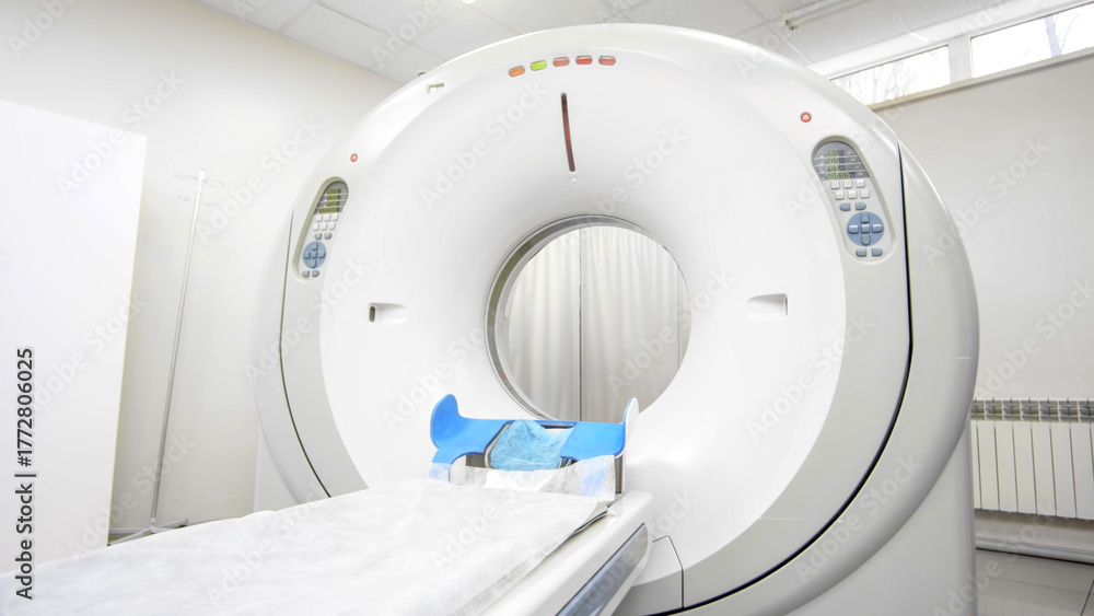Photo Stock CT scanner machine in a bright medical room, featuring a ...