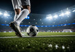 © Kleber - Dynamic action shot of a footballer kicking a soccer ball on a vibrant, illuminated stadium field at night