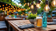 © syhin_stas - Frosty beer mug with a foamy head sitting on a wooden table, enjoying the evening atmosphere of an outdoor bar patio lit by warm bokeh string lights
