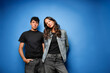 © ADDICTIVE STOCK - Young people with casual fashion on blue background