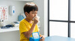 © Iryna - Child coughing with tissue box in pediatric room, health care and cold relief