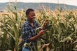 © Jelena - African american female farmer using digital tablet in corn field