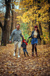 © ADDICTIVE STOCK - Family enjoying autumn in the park together