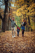 © ADDICTIVE STOCK - Family enjoying autumn in the park together
