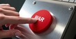 © Andre - A man's hand with an extended index finger presses a red button with the word “WAR” on it