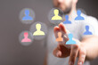 © vegefox.com - Hand pointing at user icons. Business concept, human resources, internet of things. Connecting online, management, networking, teamwork, digital