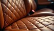 © Pete - Close up photo of luxury car interior. Brown leather with diamond pattern stitching. Automotive design with detailed texture. Elegant car upholstery for comfortable ride.