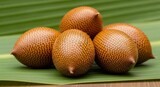 Exotic Salak Fruits on Green Leaf: Tropical Food Still Life Composition.