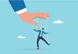 © Premium art - Domination or manipulate by control puppet doll, marionette or exploitation, authority or boss micro management, dictator or slave concept, mystery hand control string on businessman puppet doll.