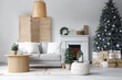 © Pixel-Shot - Interior of modern living room with fireplace decorated for Christmas