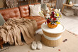 © Pixel-Shot - Table, comfortable sofa and pumpkin with autumn bouquet in interior of living room
