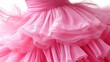 © ely - Close - up of a Pink Ruffled Tulle Dress with Flowing Layers