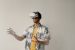 © TrueFrame Collective - Horizontal waist up portrait shot of African American student using VR set