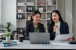 © crizzystudio - Businesswomen collaborating on financial data analysis in office