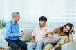 © Ekkasit A Siam - Senior asian therapist guiding couple in counseling meeting about relationship stress man listening with concern while woman looking sad, session showing professional marriage therapy emotional health