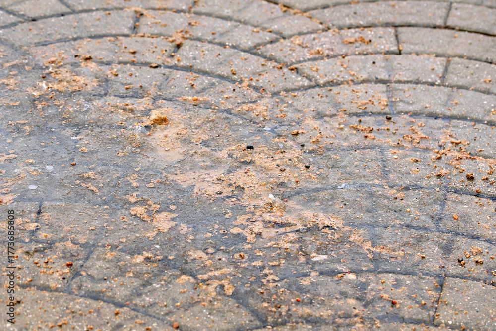 Icy sidewalk treated with sand to prevent slipping and increase ...