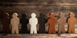 © Rifqi - Diverse wooden human figures standing together on a rustic wooden surface symbolizing unity, concept for diversity awareness, social equality and multicultural understanding