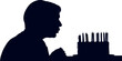 © ITHAN - Silhouette of a person blowing out candles on a birthday cake