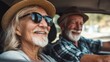 © Johannes - road trip travel and old people concept  happy senior couple driving in car no logos no brands ar 169