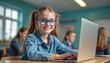 © Maryna - Happy girl with blue glasses uses laptop at desk in classroom. Other kids are blurred in background learning. Modern education and digital literacy for young students.