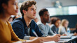 © Kateryna - In classroom multi ethnic faceless students listening to lecturer writing in notebooks smart young people study at college educational setting learning environment academic