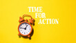 © Alena - A orange alarm clock with the words Time for Action. The clock is set to the time of