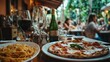 © Nazia - Authentic italian summer dinner with pasta, pizza, and homemade dishes in a rome restaurant