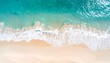 © kih - Aerial view of a pristine beach with turquoise waves breaking on the shore
