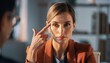 © Phanupong - Woman pointing to her temple thoughtful expression in office setting business