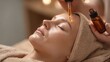 © LimeSky - Skincare concept Therapist s hands prepare to apply nourishing oil to young woman s face during a beauty treatment