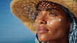 © LimeSky - Stunning Black woman applying sunscreen at the beach