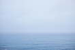 © TrueFrame Collective - Mystical depiction of Atlantic Ocean: fog hovering over it and small waves on water surface, nothing seen on horizon