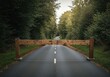 © retirementfun - Heavy wooden barrier blocking a paved road, symbolizing obstacles, challenges, and difficulties in achieving a goal. The path ahead is obstructed, blocking, fence, metaphor