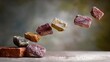 © Anna - A cluster of stones being lifted by a minor amount of sand atop a brick barrier