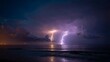 © Abdul - Dramatic lightning strikes illuminate stormy ocean sky creating powerful natural spectacle with city lights distant