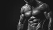 © Andrii - Muscular Bodybuilder Shows Off Fit Physique In Black And White Photo With Dramatic Lighting, Highlighting His Impressive Biceps.