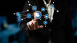 © InfiniteFlow - A business professional interacts with an array of digital connection icons on a virtual screen, showcasing the integration of technology and communication in the workplace. Tessel