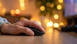 © elviana - Close Up Of A Hand Holding A Computer Mouse With Soft Bokeh Lights In The Background