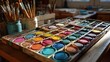 © isz - Watercolor paint palette with brushes and art supplies on display