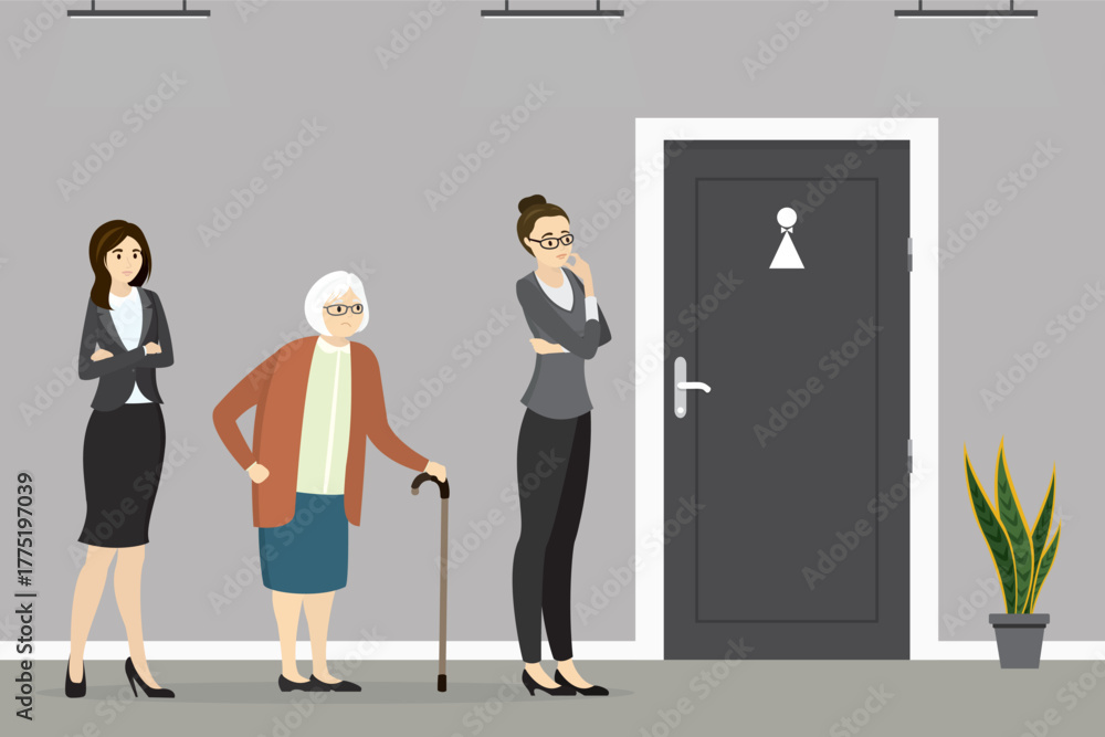 Group of women standing in hallway in front of closed restroom door ...