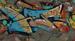 © themondunee - Graffiti art on a weathered wall features blue orange and yellow paint with black outlines