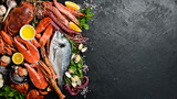 Fresh seafood, shellfish, crustaceans and fish. Background of marine food. Top view.