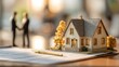 © Jam - Confident couple with model house discussing property-backed mortgage loan financial agreement concept