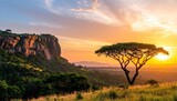 African Savannah Sunrise Over Rolling Hills with Acacia Tree and Dramatic Sky