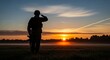 © Laut - Soldier saluting at sunset silhouette honor respect and military service