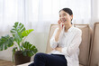 © hidez - Smiling Woman Wearing Wireless Earphones Indoors