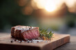 © SolaruS - Juicy mediumrare steak on a wooden board, seasoned with salt, pepper, and rosemary, bathed in the golden light of sunset. Perfect for culinary, lifestyle, or food blog.