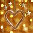 © Eduards V. - Heart-shaped ornament and stars, with a soft bokeh background, representing love and romance