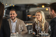 © Creative Light - Business colleagues enjoying a meal and conversation at a restaurant